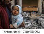 Small photo of Palestinians lose a house after an Israeli air strike belonging in the city of Rafah in the southern Gaza Strip, on December 29, 2023.