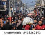 Small photo of Palestinians crowd at a local street market in Rafah. UNRWA said the population of the city of Rafah has nearly quadrupled to more than 1.300 million people, in Gaza Strip, on January 18, 2024.