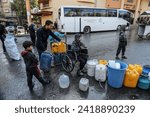 Small photo of Displaced Palestinians fill pots with potable water from the United Nations headquarters, UNRWA, in the city of Rafah in the southern Gaza Strip, on January 29, 2024.