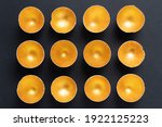 Small photo of Gold glitter eggshell on a black background. Creative glowing easter design template for advertising banner. Equality and inequality concept. Glamorous eggs. Splurge concept.