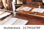 Small photo of School in a Catholic Jesuit monastery. Education in the Middle Ages. Ancient manuscripts and parchment with a quill pen lie on aged wooden desks. Class in a medieval university with monks as teachers.