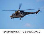 Small photo of Kecskemet, Hungary - August 27, 2021: Military helicopter at air base. Air force flight transportation. Aviation and rotorcraft. Transport and airlift. Military industry. Fly and flying.