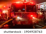 Small photo of Bronx, New York USA January 28, 2021 Firefighters battle a 3 alarm fire in the Bronx that burned down seven stores.