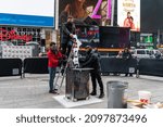 Small photo of New York City, NY USA December 28, 2021. Times Square host the annual Good Riddance Day where revelers write down their bad memories and burn them.