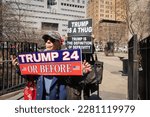 Small photo of New York City, NY USA March 27, 2023. Trump supporters outside of the courthouse in lower Manhattan where a grand jury is expected to indict former president Donald J. Trump.