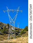 Small photo of Electricity pylons, in a mountain place. Origin, transport and need for electricity. Environmental defacement. Eletricity grid.