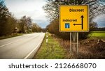 Small photo of Street Sign the Direction Way to Discreet versus Indiscreet