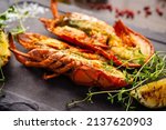 Small photo of Lobster with flavored butter. Herb butter, lemon. Delicious healthy traditional food closeup served for lunch in modern gourmet cuisine restaurant