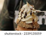 Trdelnik from Czech republic. Trdelnik or trdlo - traditional Czech dessert in the form of a spit cake. Delicious pastries filled with ice cream. National cuisine.