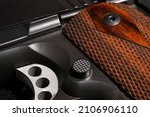 Firearm close up with rosewood grips