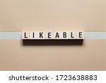 Small photo of Likeable word concept on cubes