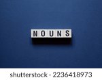 Small photo of Nouns - word concept on cubes