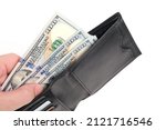 Small photo of Black leather wallet in hands with stack hundred dollar bills and bank cards on white background.Concept wealth and affluence