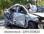 Small photo of Traffic accident on the street, damaged car after a collision in the city. Accident due to speeding and alcohol intoxication. Transport background. The concept of road safety and insurance