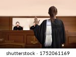 Small photo of attorney woman on courtroom give swear words to magistrate in court room. Law and legal adjustment concept. The attorney communication on courthouse.