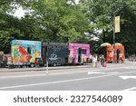 Small photo of New York, NY, USA-June 18, 2023: Mobile concession stands offering refreshments to tourists and locals, near Central Park