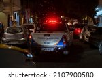 Small photo of Puerto Vallarta Mexico Nov 27 2021: Police truck with sign Municipal Police and siren lights on drive through the Mexican city night.