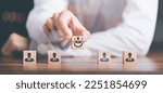 Small photo of HRM or Human Resource Management ,Strategic planning for success through people business development concept by choosing professional leaders employee competency Teamwork, man holding a wooden block