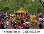 Small photo of LONDON, UK - May 6, 2023: The King and Queen in the Gold State Coach on The Mall, Coronation of King Charles III, London, UK