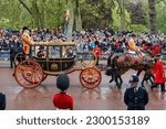 Small photo of LONDON, UK - May 6, 2023: Carriage containing Duke and Duchess of Gloucester and Vice Admiral Sir Tim Laurence, Coronation of King Charles III, London, UK