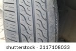 Small photo of old black tire treads that are broken and worn. time to change tires. Tire tread problem and solution concept.
