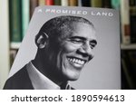 Small photo of Viersen, Germany - January 2021: Close up of isolated book cover Barack Obama a promised land, shelf background