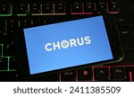 Small photo of Viersen, Germany - January 4. 2024: Closeup of smartphone with logo lettering of chorus.ai on computer keyboard (focus on center)