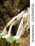 Small photo of TURNER FALLS, OK: Turner Falls, an American waterfall, at 77 feet, is locally considered Oklahoma's tallest waterfall. The falls are located on Honey Creek in the Arbuckle Mountains.