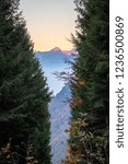 Small photo of Mountain Les Diablerets (3210) in pine trees window, view from Col de Taney. Canton of Valais, Switzerland.