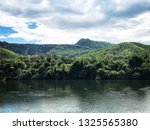 landscape forest beside the... | Shutterstock . vector #1325565380