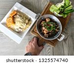 hand holding a food | Shutterstock . vector #1325574740