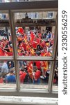 Small photo of Windows frames , cheering people. Macedonian national colors. Red and yellow colors. Macedonian flag. 6. 19. 2023. Manchester. UK.