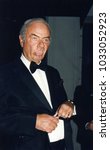 Small photo of Los Angeles, California - exact date unknown - circa 1990: late comedian Harvey Korman from the Carol Burnett Show making a funny face as he arrives at a celebrity event