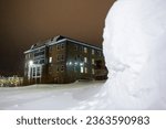 Small photo of Night winter view of a building in a northern city in the Arctic. The building of the Administration of the Anadyr municipal district of the Chukotka Autonomous Okrug. Anadyr, Chukotka, Russia.