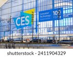 Small photo of Las Vegas, NV 1-10-2024: Exterior of Convention Center West Hall during CES2024. Logo of CES on glass wall. Light trails from car headlights of traffic passing by. Captured in long exposure.
