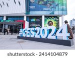 Small photo of Las Vegas, NV 1-12-2024: Hashtag CES2024 object in front of Convention Center West Hall. This year's theme "All on" printed on wall with CES logo. A group of people attending event in background