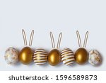 Easter eggs and easter bunny on white background with copy space. Easter background. Top view