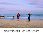 Small photo of Cartagena, Bolivar Colombia - 1 February 2024: Cartagena fishermen begin to retrieve the trammel at the seashore at the end of the daily fishing.