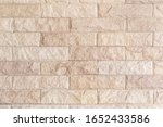Background and texture stone cladding wall.