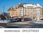 Small photo of CHERNIVTSI, UKRAINE - January 09, 2024. Bus Iveco, trolleybus Skoda 15Tr #376 (ex. Kosice #1017) and #375 (ex. Zlin #366) riding with passengers in the streets of Chernivtsi.