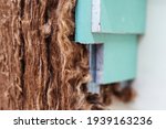 Small photo of Mineral wool wall insulation. Fragment of a plasterboard construction lined with heat-insulating material. Annotation. Close-up
