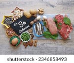 Small photo of Food rich in selenium, with the symbol Se and atomic number 34 for the chemical element selenium. Natural healthy sources of selenium. Spinach, red meat, egg, mushroom, bean, chicken, seeds, nuts