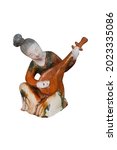 Small photo of Tri-color figurine, musician isolated on white background with clipping path. Ancient chinese statuette, Tang Dynasty.