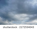 Small photo of Dark and grey featureless layers of nimbostratus clouds.