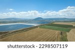 Professional aerial photography of 2 water reservoirs between agricultural areas. A beautiful view of agricultural fields and water reservoirs