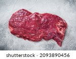 Small photo of Raw Organic Flank bavette or flap beef steak. White background. Top vie