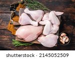 Small photo of Assortment of chicken portions for Bbq grilling. Raw parts - drumstick, breast fillet, wings, thigh. Wooden background. Top view.