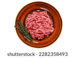 Raw mince angus wagyu beef, ground meat with herbs on a plate. Isolated on white background