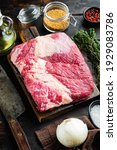 Small photo of Packer brisket, raw beef brisket meat set,with ingredients for smoking making barbecue, pastrami, cure, on old dark wooden table background