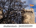Small photo of VALENCIA, SPAIN - March 8, 2024: Side View of the 15th Century Quart Towers (Towers of Quart) in Valencia with the Flags of Spain and Valencia on top. The Towers were built between 1441 and 1493.